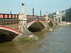 Lambeth Bridge, built by the LCC in 1932, its red colour being that of the nearby House of Lords
