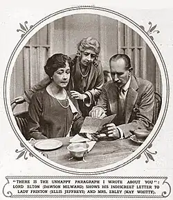 man and two women at a table, examining a letter