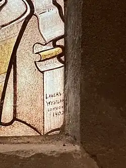 Lavers and Westlake signature from a window in Cht Church, Reading dating from 1902. Yellow background, brown text