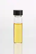 Lemongrass (Cymbopogon flexuosus) essential oil in clear glass vial