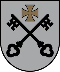 Argent two keys sable saltirewise under a cross pattée or (Lesser coat of arms of Riga, Latvia)