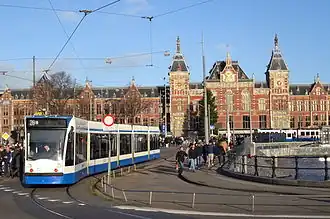 Line 26 tram running around a loop in front of Centraal station