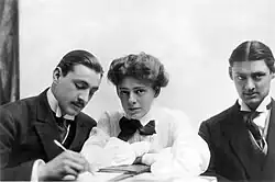 Bust-length images of the three Barrymores sitting together at a table. Barrymore has a moustache, as he does in most photos.