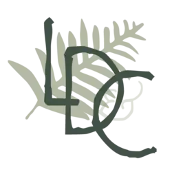 Green letters "LDC" diagonally across a light green fern leaf.