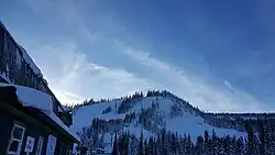 Snowy mountain with ski lodge
