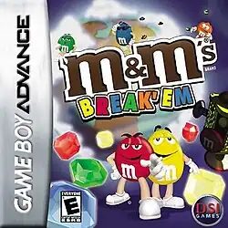 Five cartoon depictions of M&M candies with gems surround a cloudy planet with brown continents. The M&M's logo covers most of the planet and the words "BREAK' EM" appear below the logo.