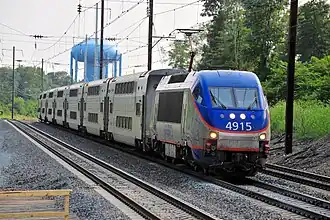 A MARC HHP-8 leads an express train into Odenton station in Odenton, Maryland