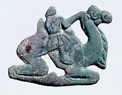 Nomadic figure, typically with a long nose, on a Bactrian camel. Southern Ningxia, 4th century BC.[101][99]