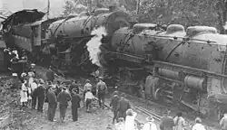 Mallet locomotives 716 and 729 on the southbound track after the twenty mile per hour collision. A conductor had just stepped out of a trackside phone booth when the train hit it. A passing train was just barely caught before it would have hit the wreckage.