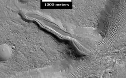 Layered deposit in the Mamers Valles, as seen by HiRISE.