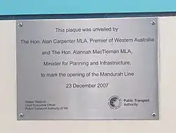 A metal plaque on a wall
