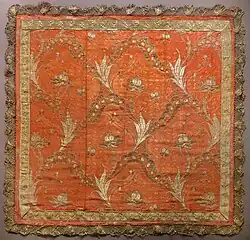 This French pontifical gremiale has embroidery and lace edging.