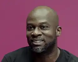 Joseph against a pink background