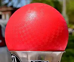 A close-up of a textured red ball