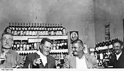 Men in front of the Stuart Arms Hotel bar in 1921