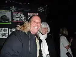 Fashion designer Michael Kors at Julius's with a fan in January 2015