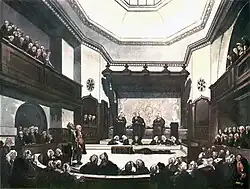 A drawing of the Court of Common Pleas, created in the early 1800s. Three Justices in black robes stand on podiums in the middle of the room, hearing a case. Around the outside of the room, the public is listening in on the case.