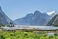 View from head of Milford Sound of some of the Darran Mountains on the north side of sound being The Lion and beyond it Rover Peak 1,524 m (5,000 ft)[1] and snow covered Mount Pembroke 2,015 m (6,611 ft).[1]