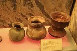 Burial pots, with the right having wave designs