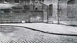 1938 photograph of Mitre Square. The body of Catherine Eddowes was discovered close to the fence seen at the centre of this image on 30 September 1888