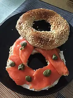 Bagel with lox, cream cheese, and capers