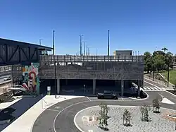 Multi-storey car park viewed from a nearby bridge