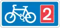 Rectangular, blue traffic sign with a white bicycle symbol and a red square with the number 2 in it.