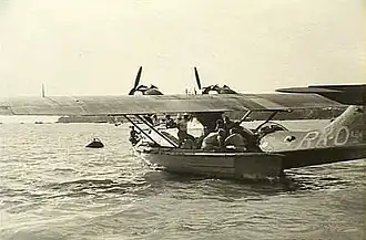 Twin-engined military amphibious aircraft in harbour