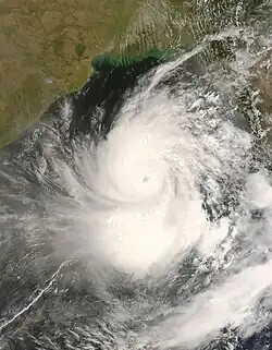 The image shows Cyclone Nargis near peak intensity on May 1 in the Bay of Bengal. India is visible to the left, while Myanmar, the eventual landfall location, is visible to the right.