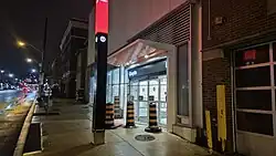 Photo of a modern subway station entrance under construction.