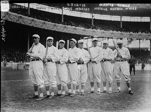 Image 6The NL champion New York Giants baseball team, 1913. Fred Merkle, sixth in line, had committed a baserunning gaffe in a crucial 1908 game that became famous as Merkle's Boner. (from History of baseball)