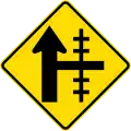 Railway level crossing on side road to right