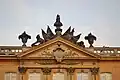 A close-up of the coat of arms at the roof above the entrance