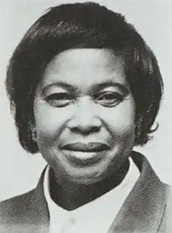A short-haired black woman in a business suit