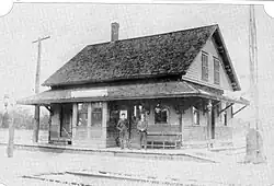 A one-and-a-half story wooden railway station