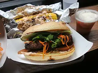 Num Pang Cambodian Sandwich Pork Belly, grilled corn, pickles