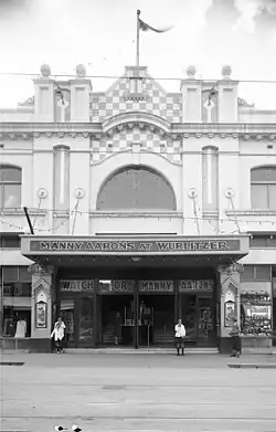 Image showcasing the theatre's iconic checkered parapet and led light windows. Marquee advertising guest Wurlitzer organist, Manny Aarons