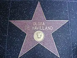 Five-pointed star with her name and an image of an old film camera