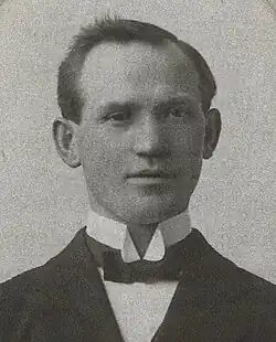 Young, clean-shaven man, in wing collar