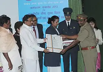 CBIC Inspector (right) receives Presidential Certificate of Appreciation 2013.