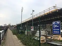The bridge gradually descends between the Manchester Ship Canal and the Bridgewater Canal.