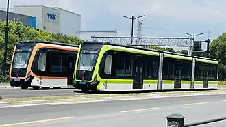 Two Autonomous Rail Rapid Transit vehicles parked together in Shanghai, China