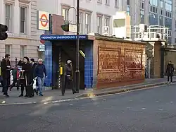 A narrow single-storey tiled building with a London Underground roundel above a sign reading "Paddington Underground Station"