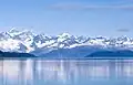 View from Glacier Bay, Mt. Turner centered on skyline with Mt. Root to left.