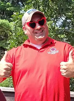 Patrick Boyd wearing large red heart-shaped plastic classes