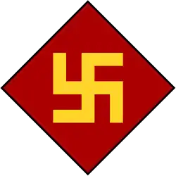 A red diamond with a yellow swastika inside it