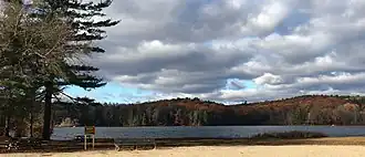 Paugnut State Forest's hills in autumn viewed from the north-east shore of Burr Pond
