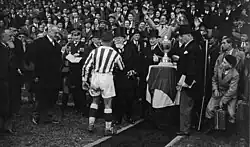 Louis Cler shaking hands with Paul Doumer after winning the final.
