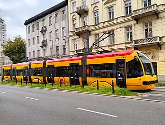 Five-section yellow tram