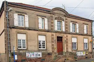 The town hall and school in Pexonne